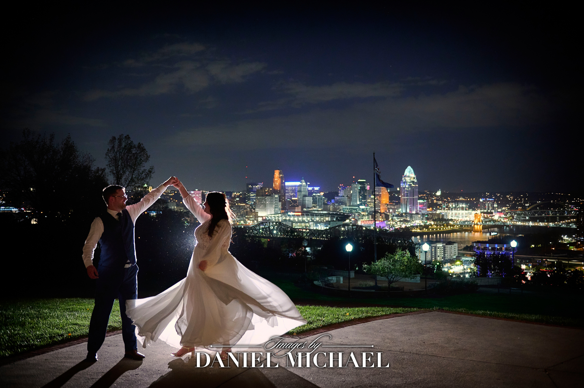 Cincinnati Skyline Wedding Photography at Drees Pavilion with Bride Spinning in Dress